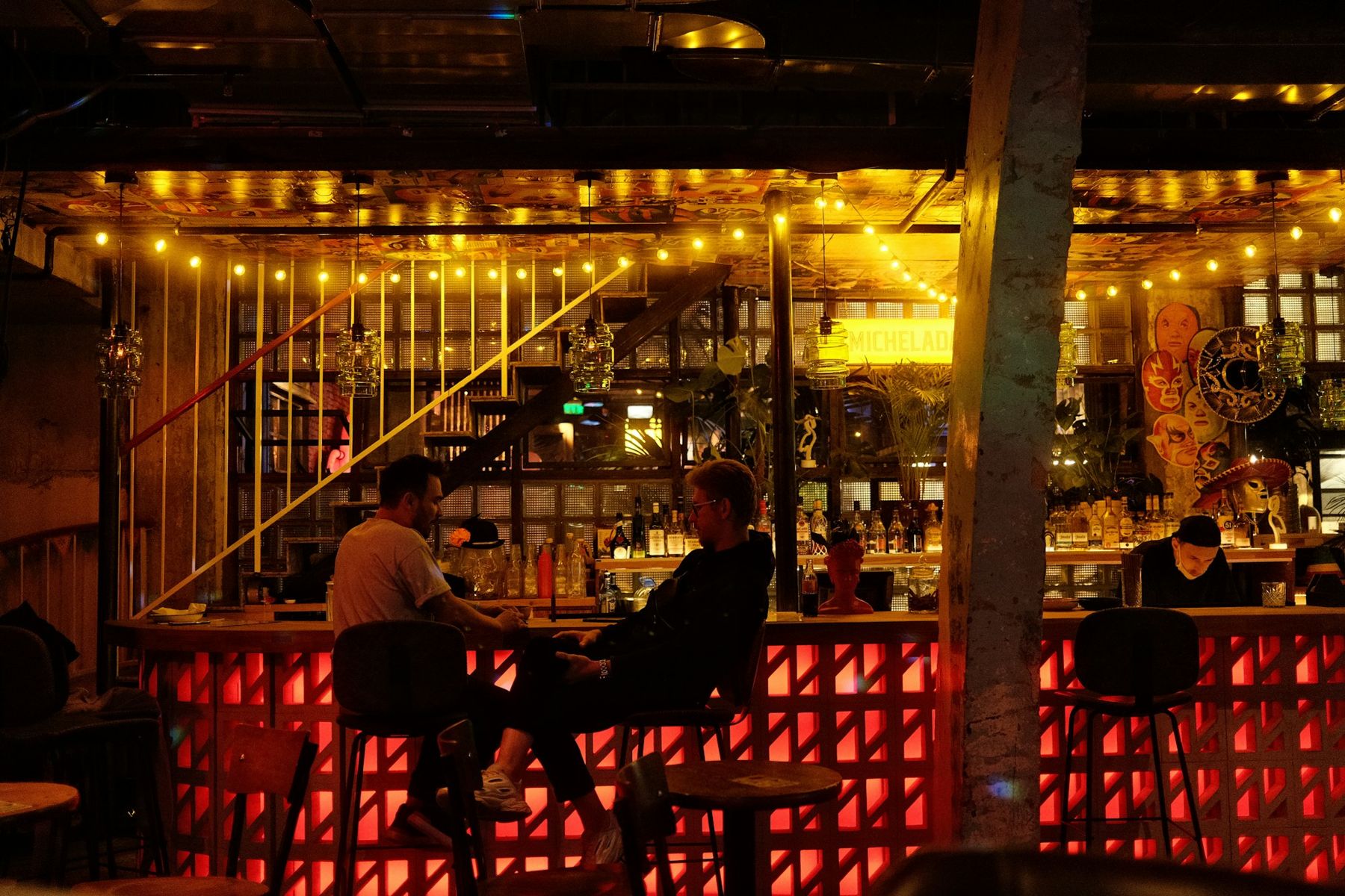 Guests lined up along a crowded bar