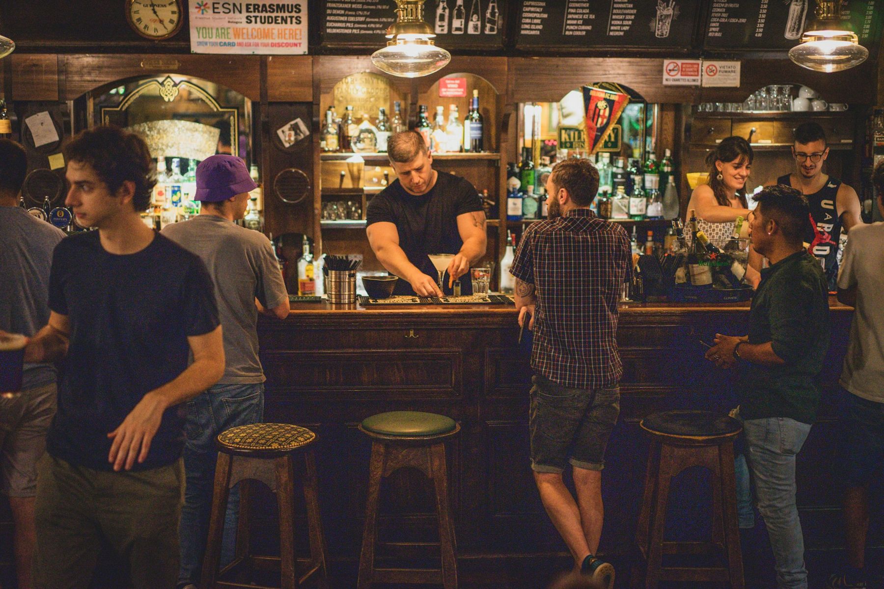 Guests ordering at a busy pub bar